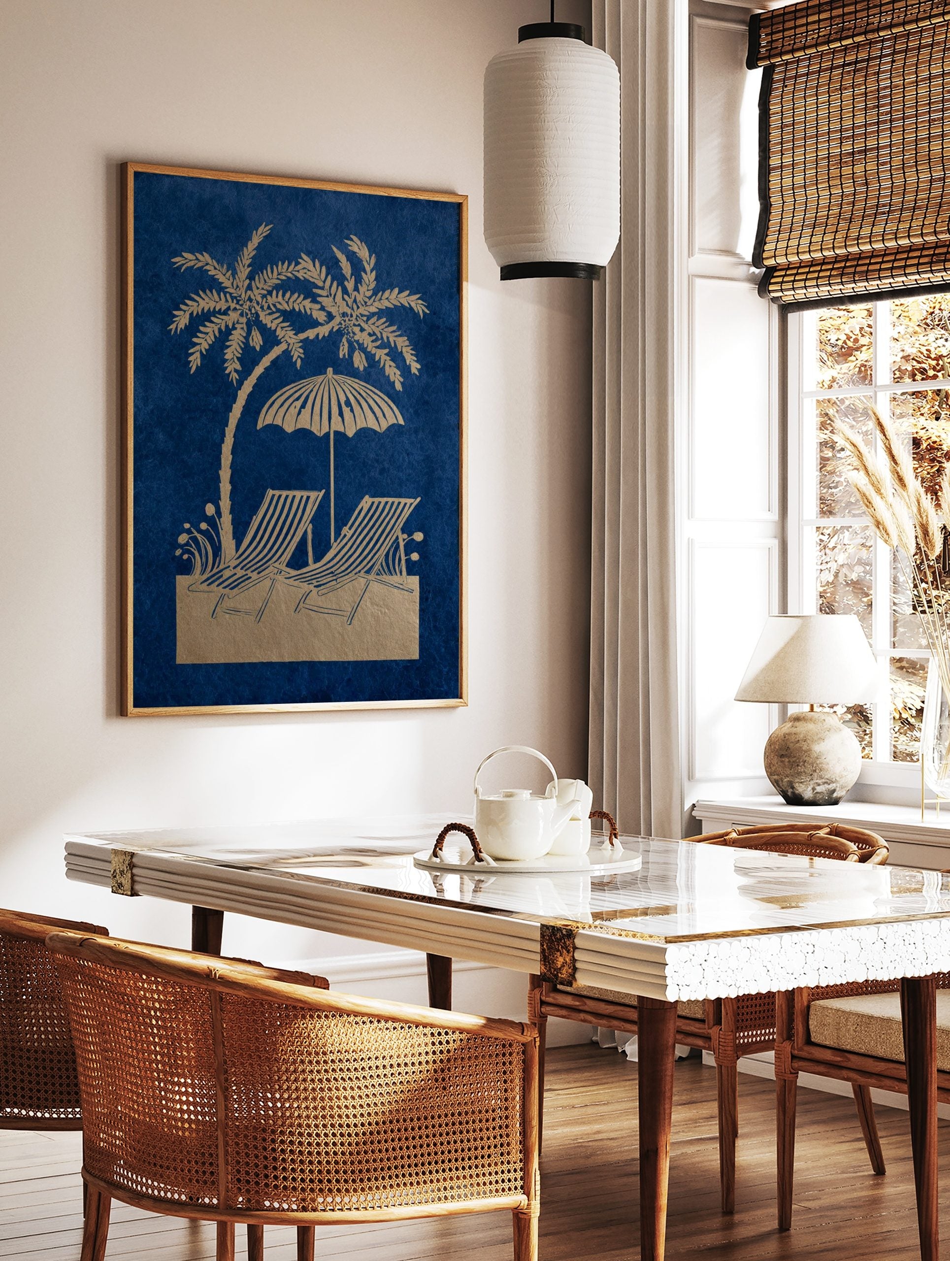 Golden palm tree, beach umbrella, and two striped deck chairs on a blue background in an, in a styled room mockup