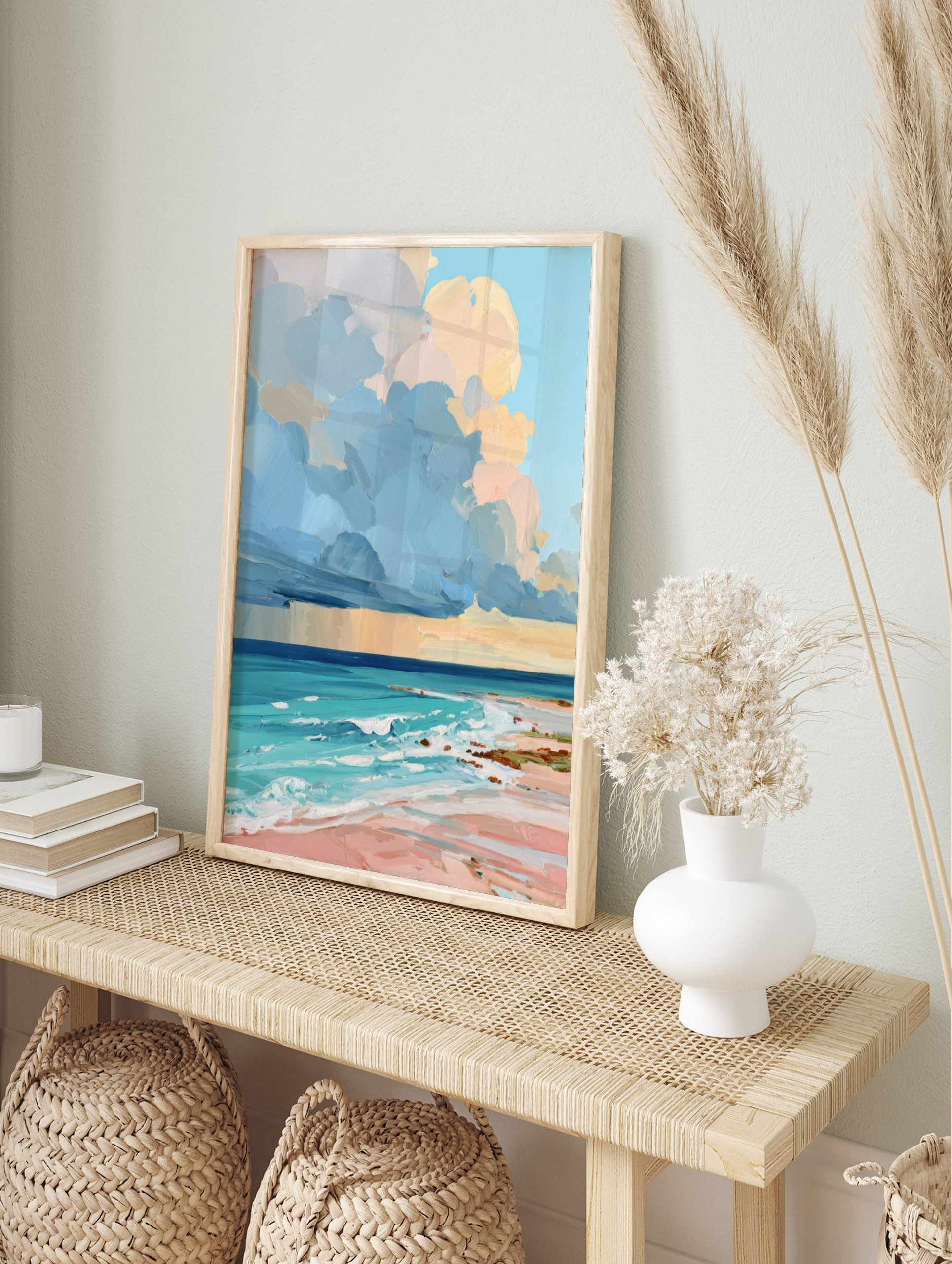 Colourful painterly beach scene art print with blue and peach clouds, turquoise ocean, and, in an alternate framed mockup