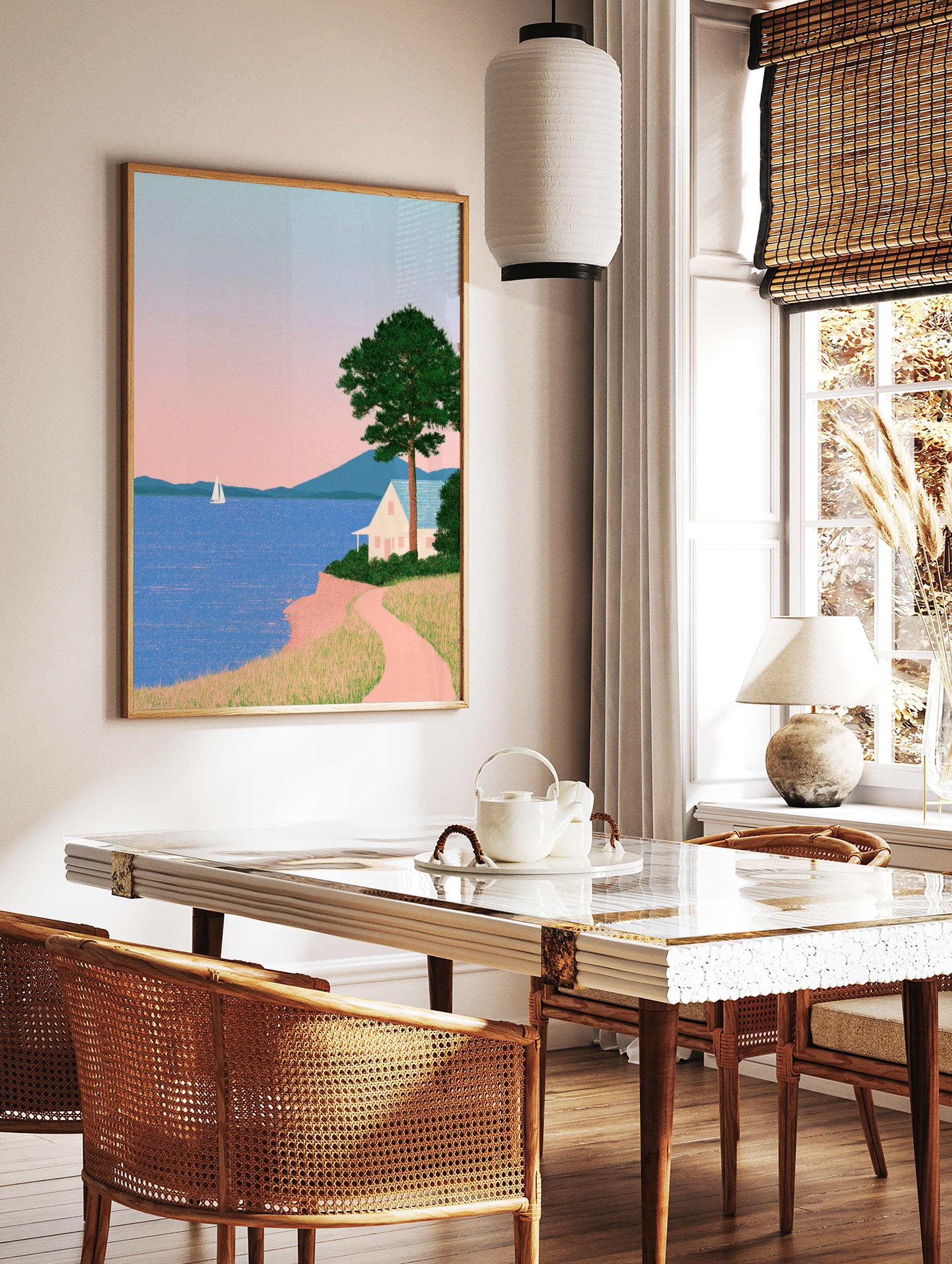Minimalist coastal landscape art print featuring a white house on a cliff, a sailboat, mountains, in a styled room mockup
