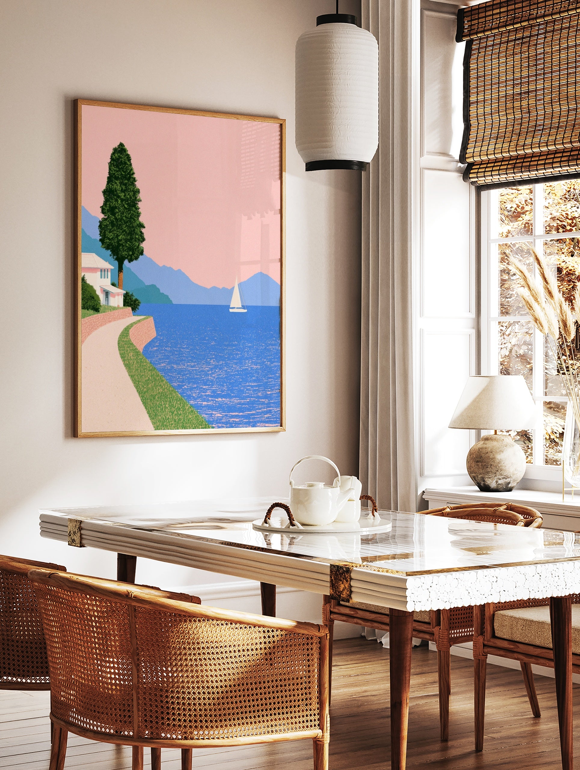 Minimalist coastal wall art featuring a white house, winding path, sailboat, and blue mountains, in a styled room mockup