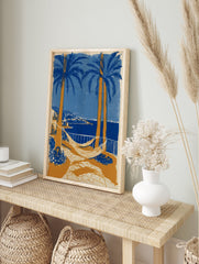 Coastal landscape poster with blue palm trees, orange trunks, white hammocks, a blue sea, and a distant town. - Image 4