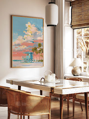 Painterly art print of a teal lifeguard hut on a beach with palm trees, under a blue and peach, in a styled room mockup