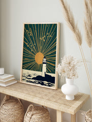 White lighthouse on rocky coast with golden sun and radiating rays in deep teal sky, birds, in an alternate framed mockup