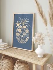 Coastal pineapple illustration with starfish, seashells, and coral elements on a blue, in an alternate framed mockup