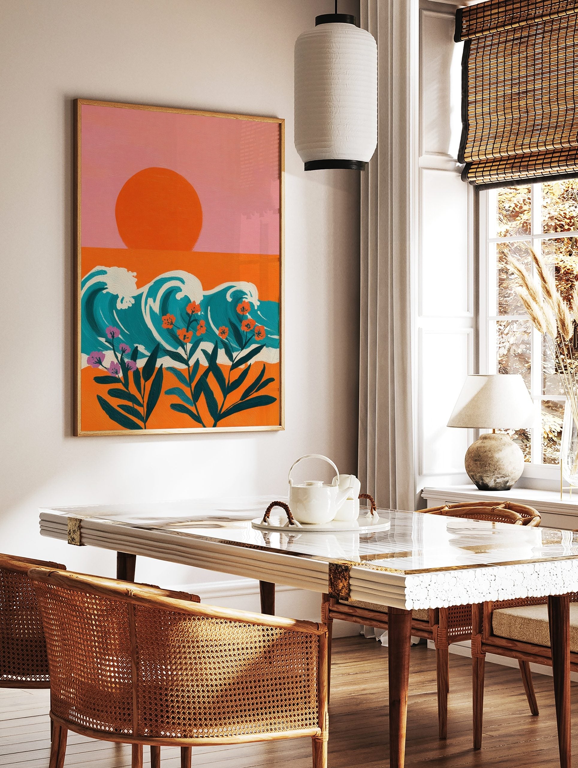 Illustrative coastal wall art with orange sun, teal waves, and orange and purple tropical flowers, in a styled room mockup