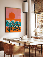 Illustrative coastal wall art with orange sun, teal waves, and orange and purple tropical flowers, in a styled room mockup