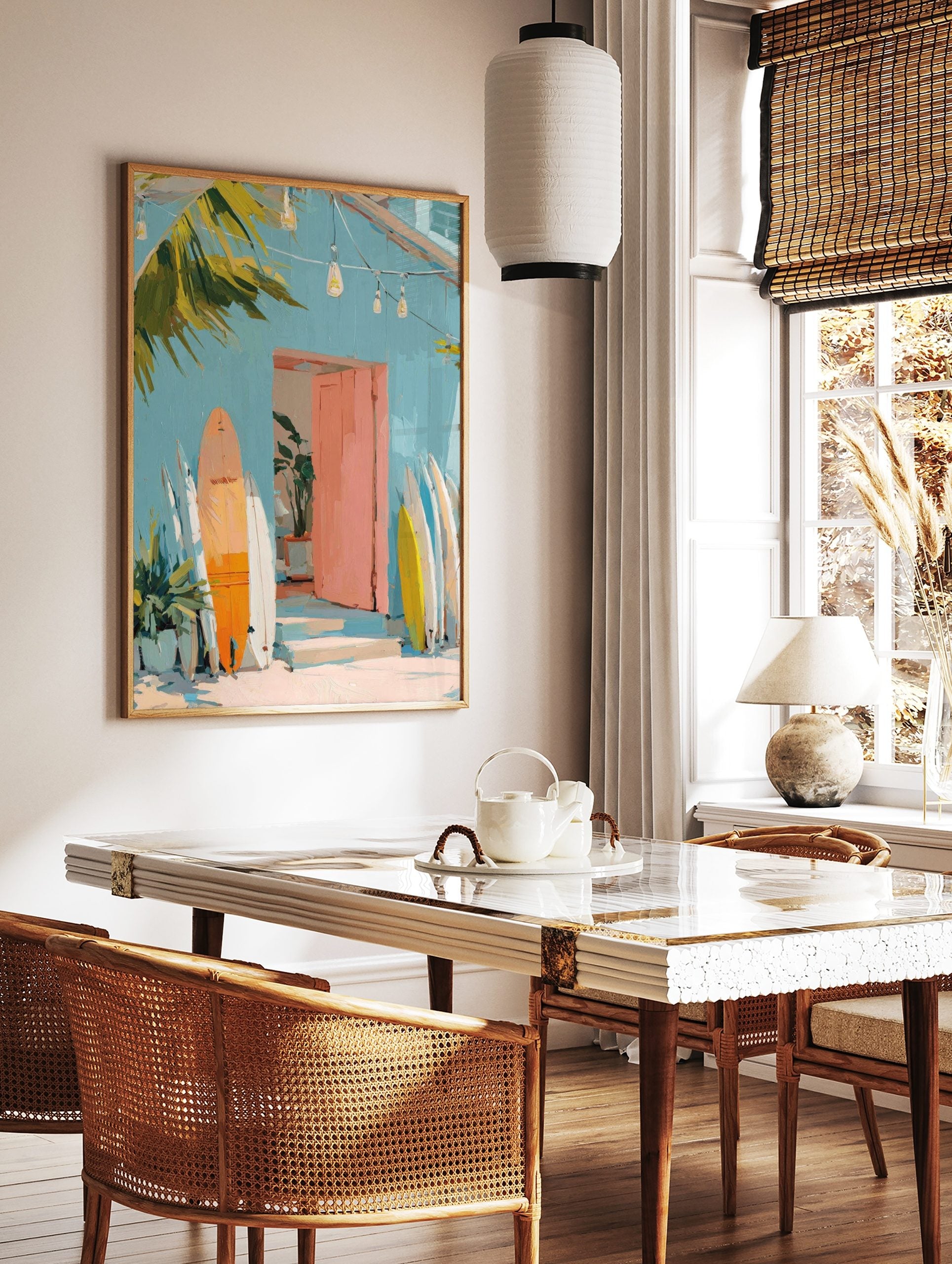 Painterly art print of a light blue building, pink door, and orange, white, yellow surfboards, in a styled room mockup