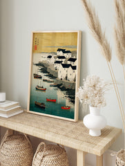 Coastal village with white houses, dark roofs, boats in blue water, rocky shore, Japanese, in an alternate framed mockup