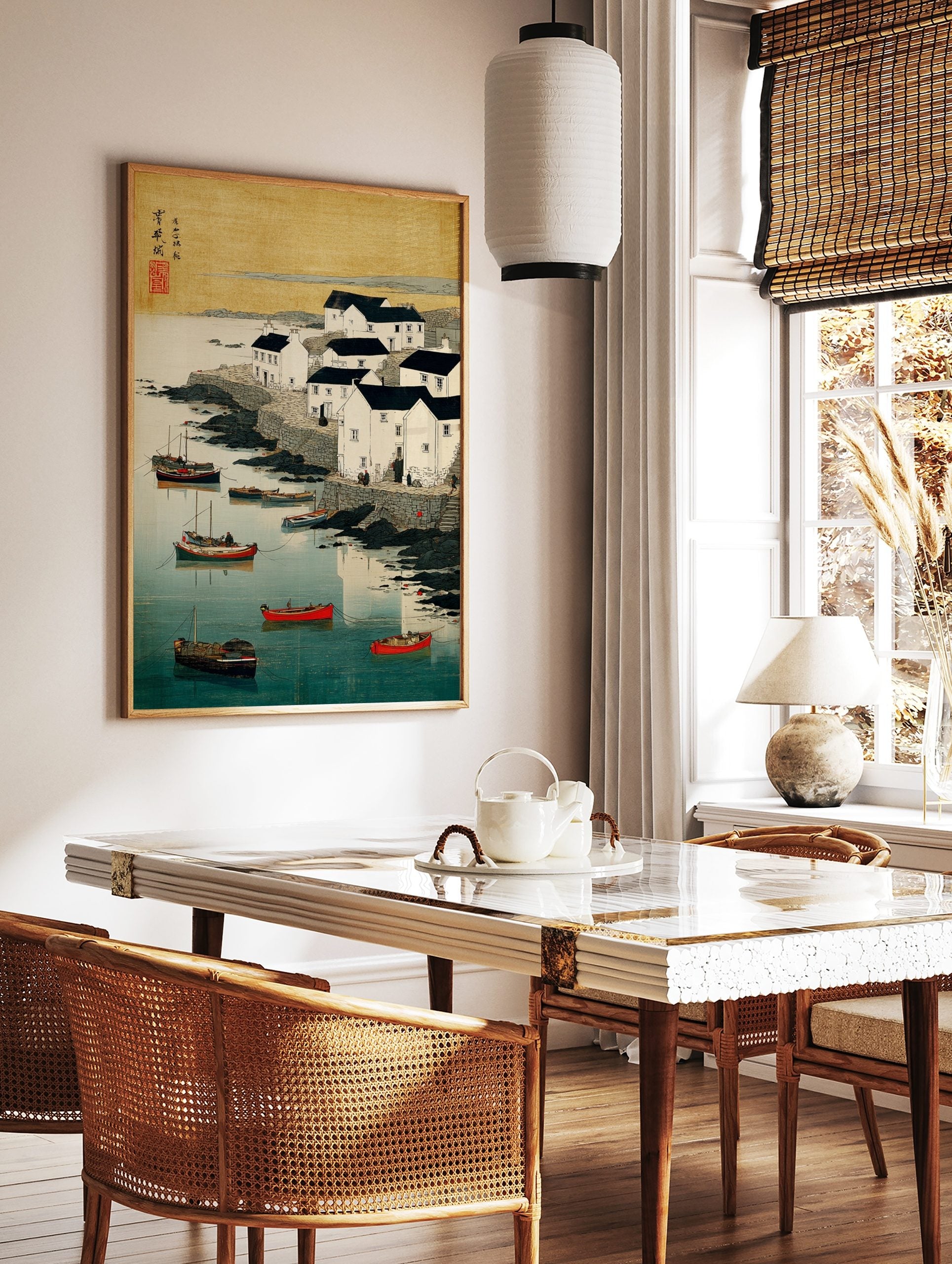 Coastal village with white houses, dark roofs, boats in blue water, rocky shore, Japanese woodblock, in a styled room mockup