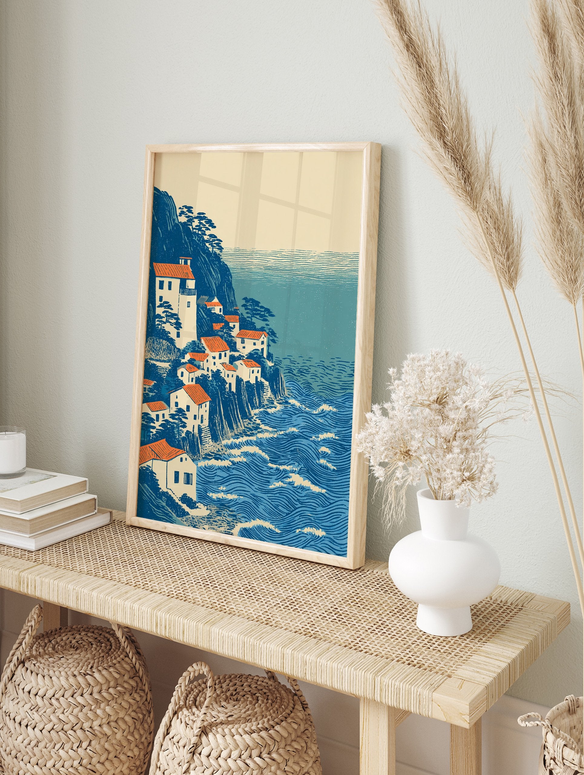 Ukiyo-e style coastal village wall art print with white houses, orange roofs, blue cliffs, and a wavy blue ocean. - Image 3