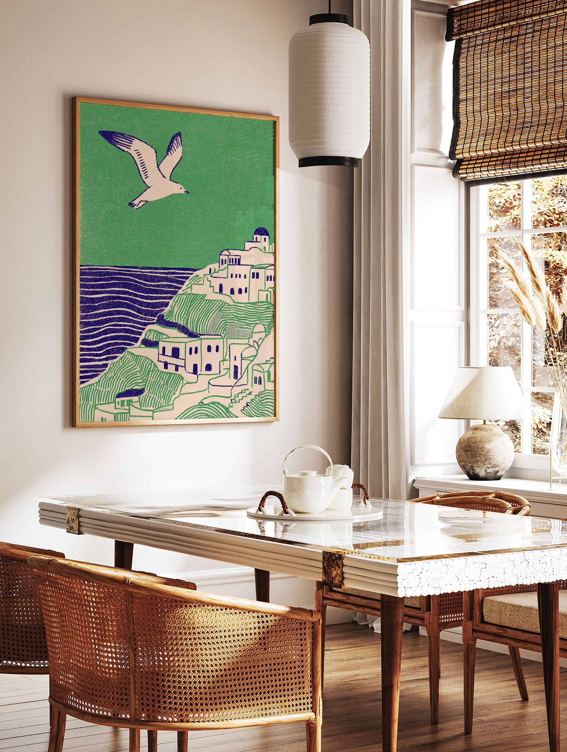Illustrative coastal wall art print showing a white village on green hills, blue sea, and a flying seagull. - Image 2