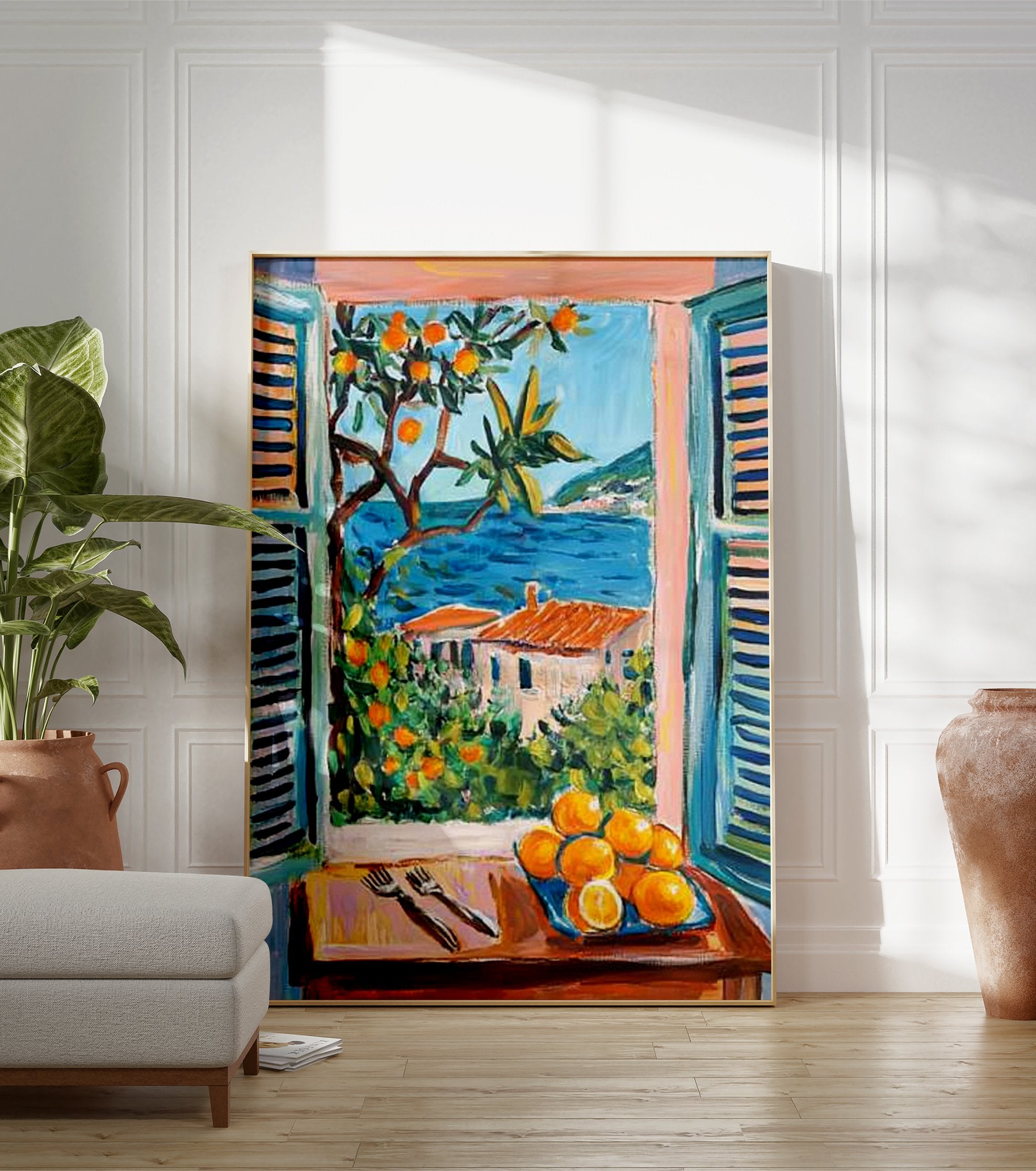 Coastal window art print showing a Mediterranean landscape with blue sea, orange trees, houses, and a plate of oranges. - Image 3