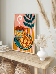 Coffee and concha sweet bread illustration with striped background and green leaf motif art, in an alternate framed mockup