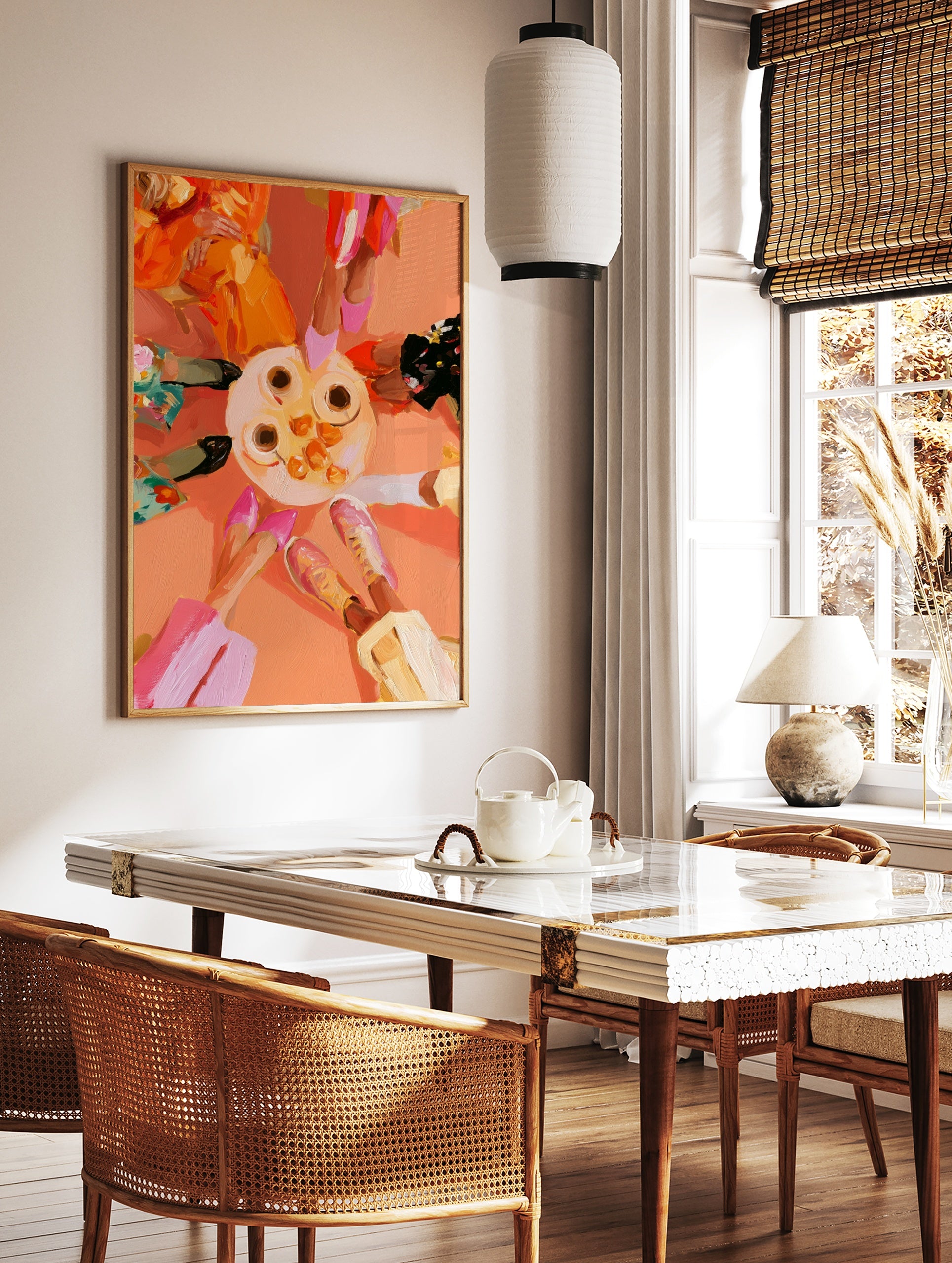 Top-down illustrative art print of a table with coffee and oranges surrounded by four people, in a styled room mockup
