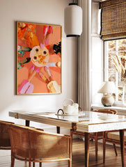 Top-down illustrative art print of a table with coffee and oranges surrounded by four people, in a styled room mockup