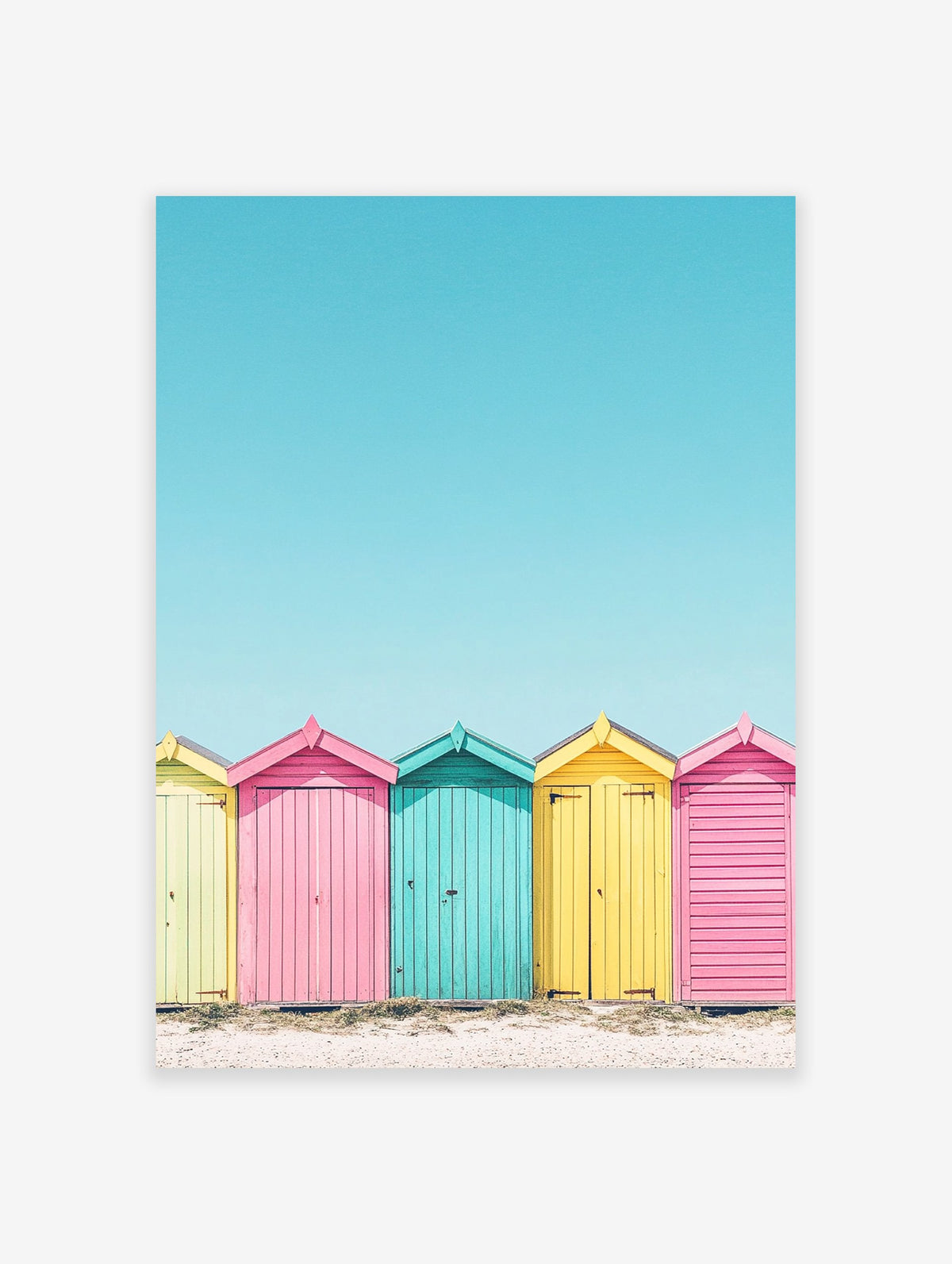 Colorful beach huts poster in yellow, pink, and teal on a sandy beach under a bright blue sky, coastal photography.