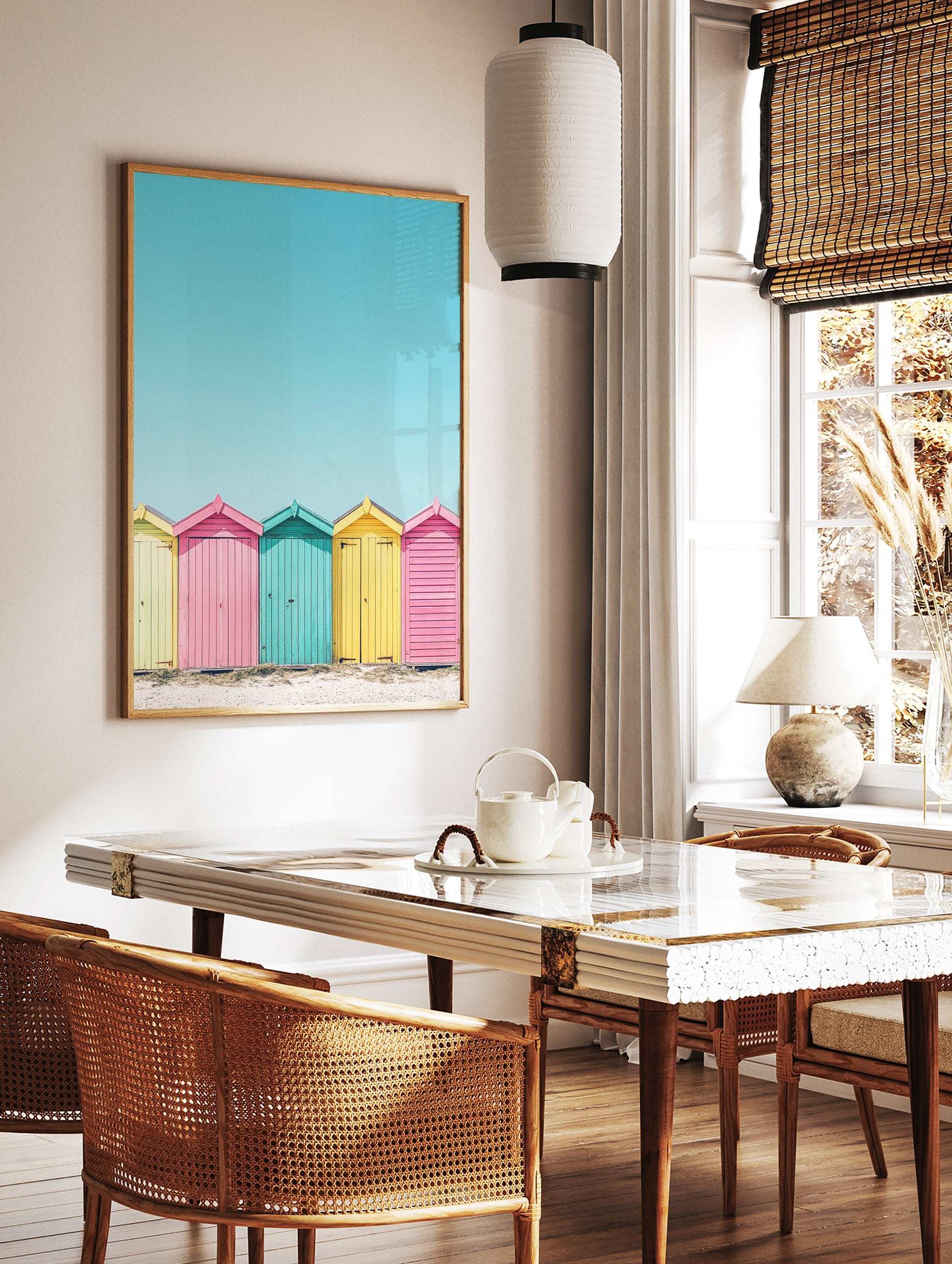 Colorful beach huts poster in yellow, pink, and teal on a sandy beach under a bright blue sky, coastal photography. - Image 2
