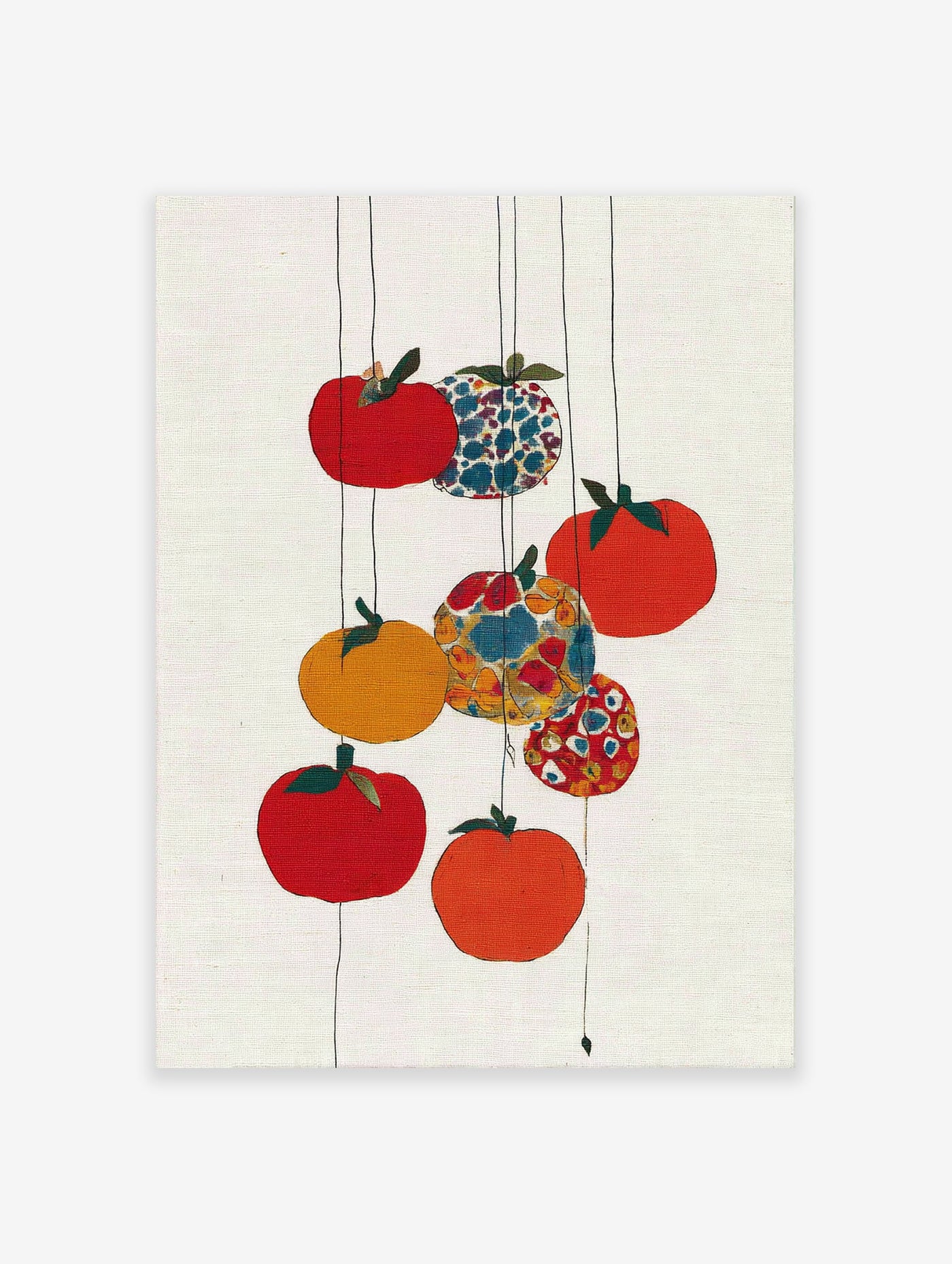 Colorful fruit wall art with red, orange, yellow, and patterned fruits hanging on thin lines against a white textured background.