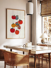 Colorful fruit wall art with red, orange, yellow, and patterned fruits hanging on thin lines against a white textured background. - Image 3