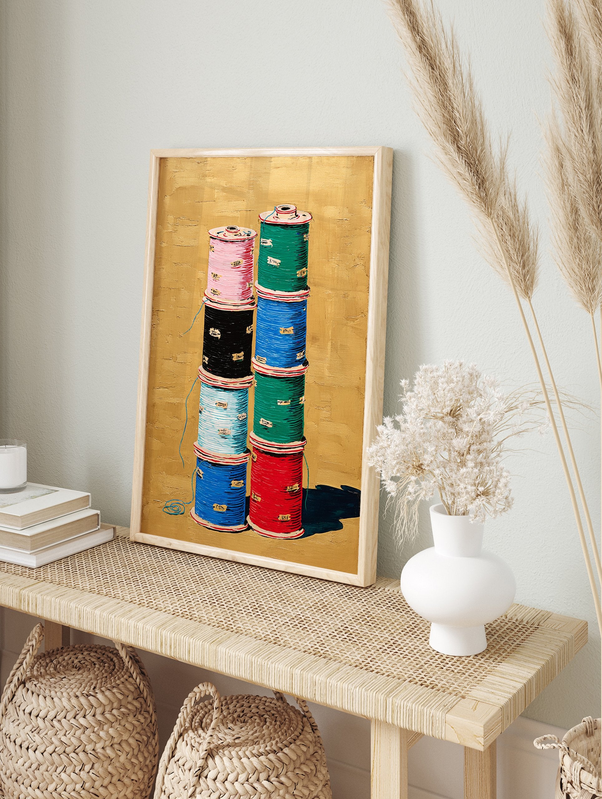 Vibrant thread spool wall art painting: two stacks of colorful spools (pink, black, blue, green, red) on a textured gold background. - Image 3