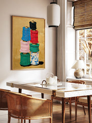Colorful thread spools art painting stacked on a gold background, featuring blue, red, pink, green, and patterned white spools. - Image 2