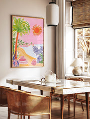Colourful illustrative beach scene with palm tree, orange sun, sandy shore, ocean, and decorative, in a styled room mockup