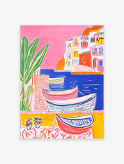 Colourful illustrative coastal town art print with boats in blue water, white buildings, and green plant