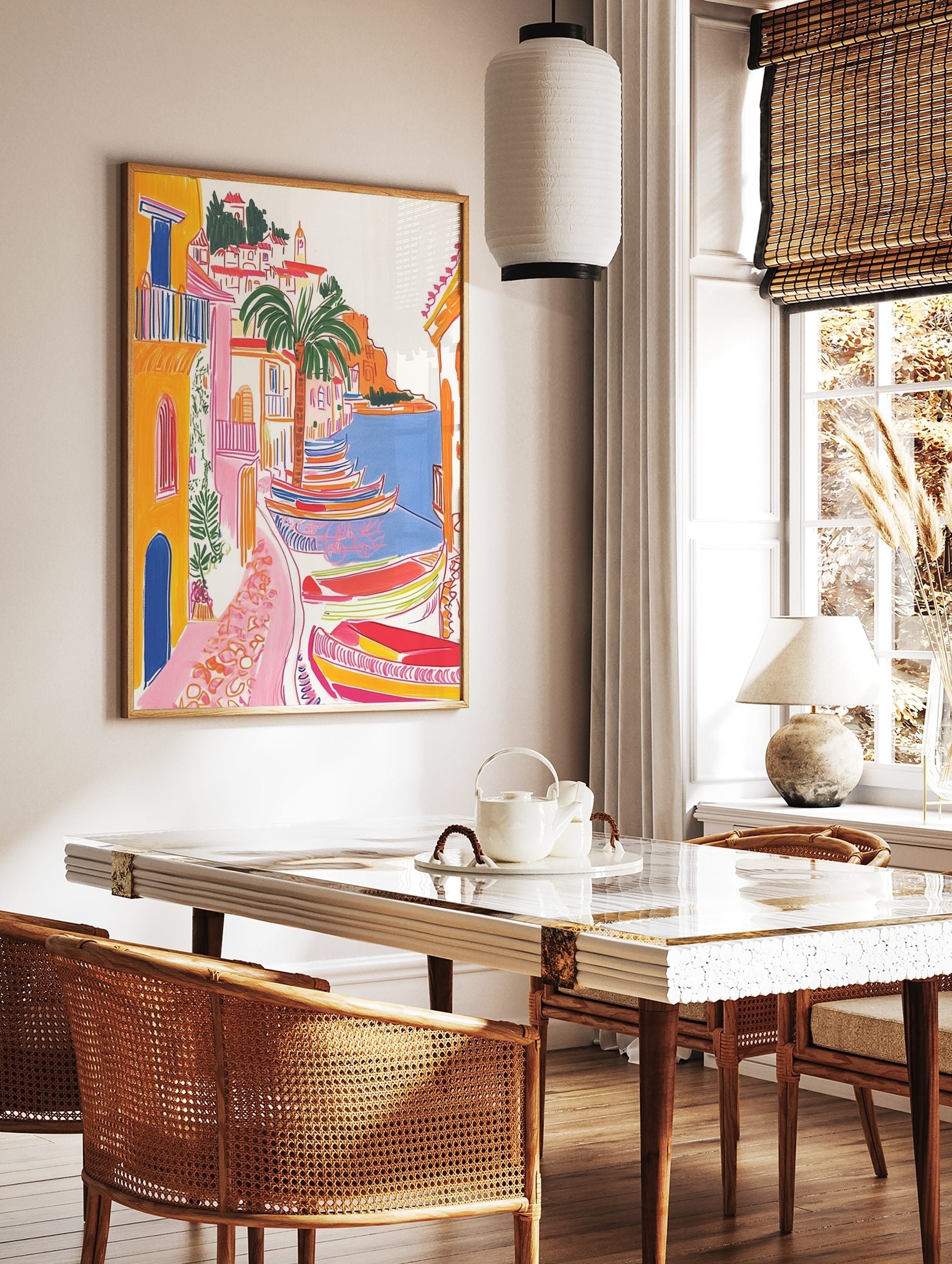 Colourful illustrative coastal village art print with yellow buildings, palm tree, and striped, in a styled room mockup
