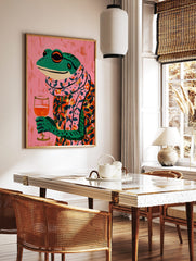 Illustrative colourful frog in floral shirt and scarf holding a wine glass on pink background, in a styled room mockup