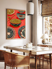 Illustrative kitchenware print with patterned bowls, plates, spoons, and a lemon slice on a red, in a styled room mockup