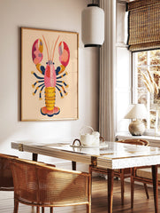 Colourful illustrative lobster wall art print with pink, orange, yellow, and navy blue dot patterns, in a styled room mockup