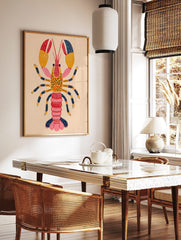 Colourful illustrative lobster wall art print with red, orange, pink, and navy blue segmented body, in a styled room mockup