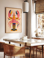 Colourful illustrative art print of a lobster with speckled pink, orange, red, and navy details on, in a styled room mockup