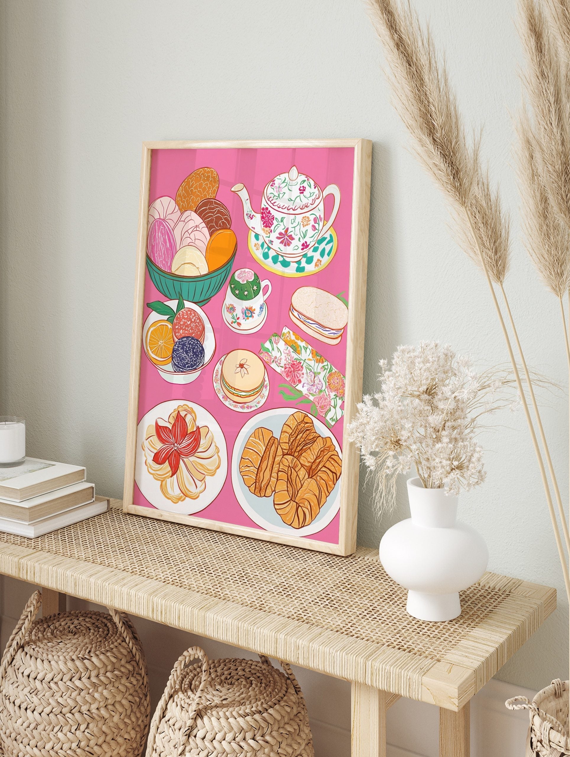 Colourful illustrative print of Mexican conchas, floral teapot, teacup, croissants, and, in an alternate framed mockup