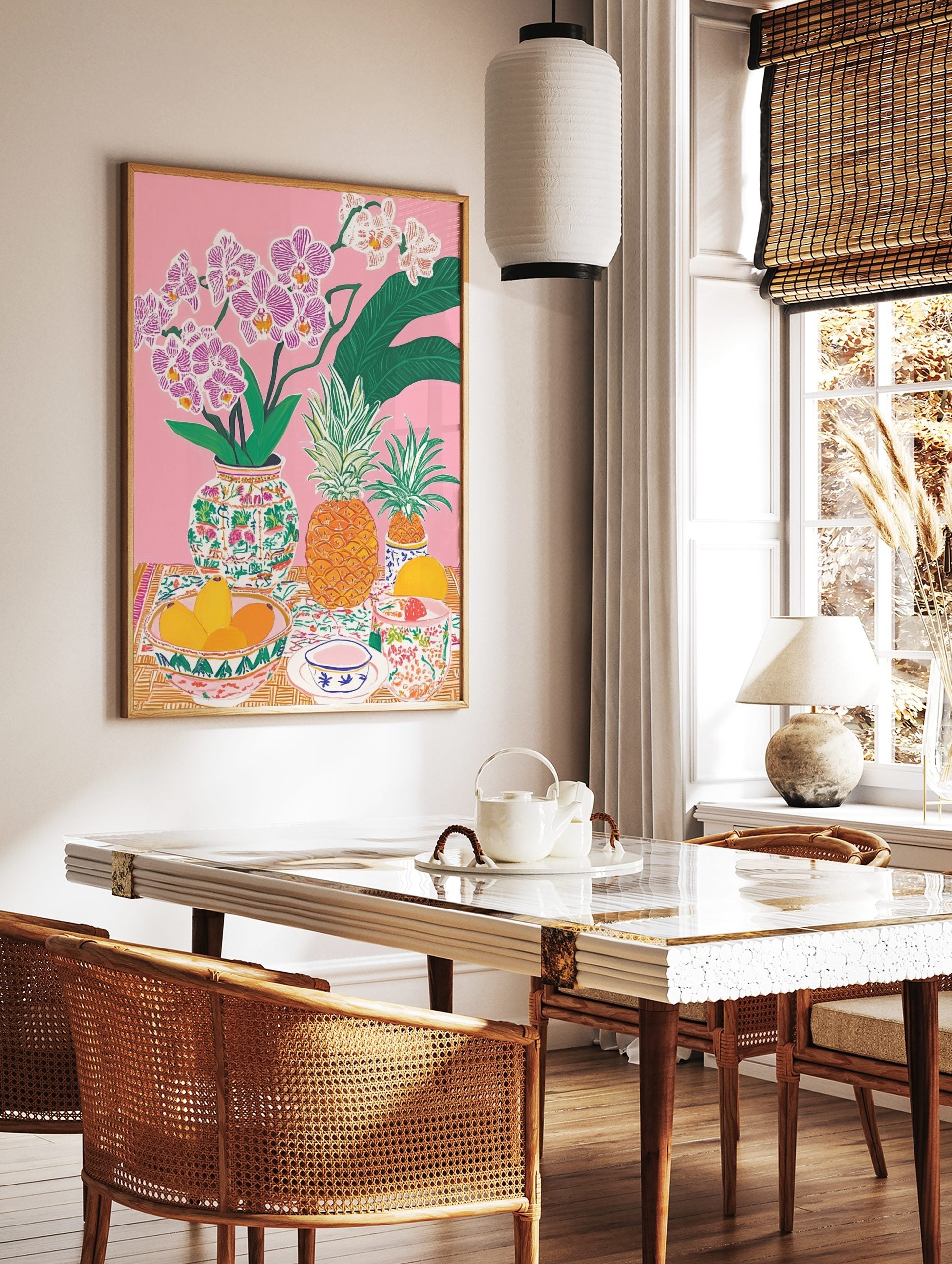 Colourful illustrative still life print with pink orchids, pineapples, mangoes, and patterned, in a styled room mockup