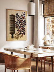 Vintage style illustration of a wooden comb and an olive branch with dark fruit on a textured cream, in a styled room mockup
