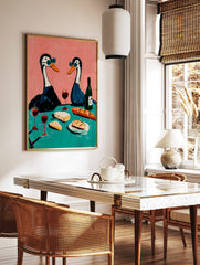 Illustrative art print of two geese in blue sunglasses having a picnic with wine, cheese, and, in a styled room mockup