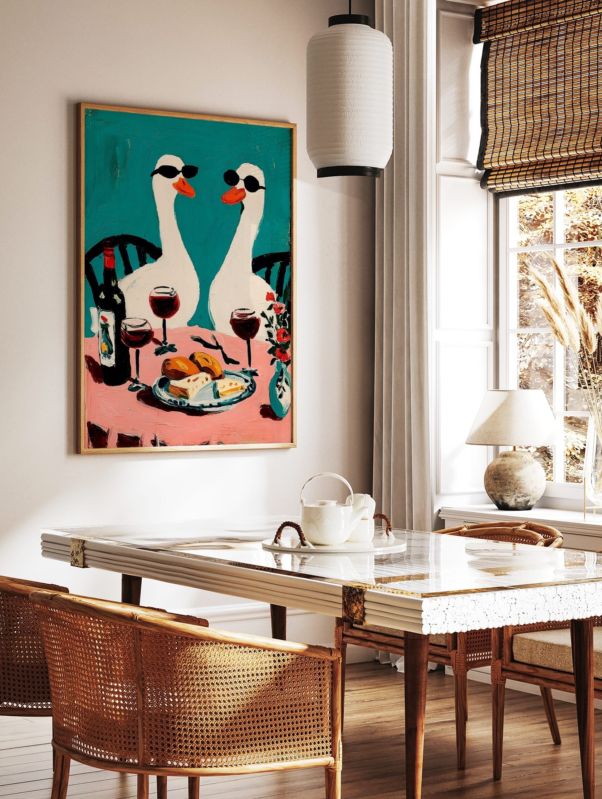 Two white geese in sunglasses at a pink table with wine and food, against a teal background, in an, in a styled room mockup