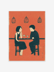 Illustrative wall art print of a couple at a bar with martini glasses, in an orange, black, and cream palette