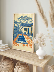Courtyard Art Print of a Mediterranean scene with a blue pool, tiled house, and tree in blue, orange, and cream. - Image 3