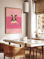 Illustrative art print of a black and white cow sitting on a pink couch against a pink background. - Image 2