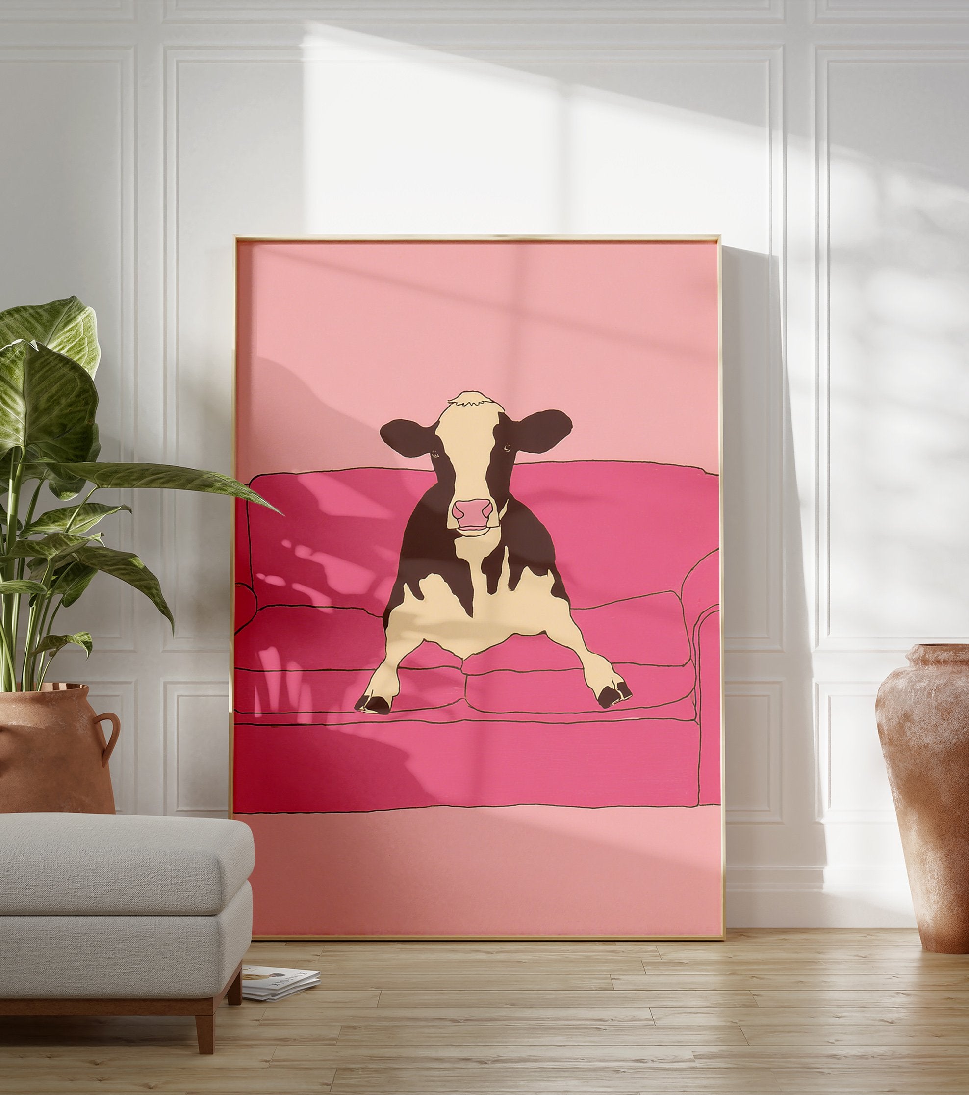 Illustrative art print of a black and white cow sitting on a pink couch against a pink background. - Image 3