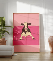 Illustrative art print of a black and white cow sitting on a pink couch against a pink background. - Image 3