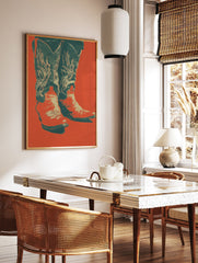 Pop art style poster featuring a pair of cowboy boots with decorative stitching against a vibrant red-orange background. - Image 2