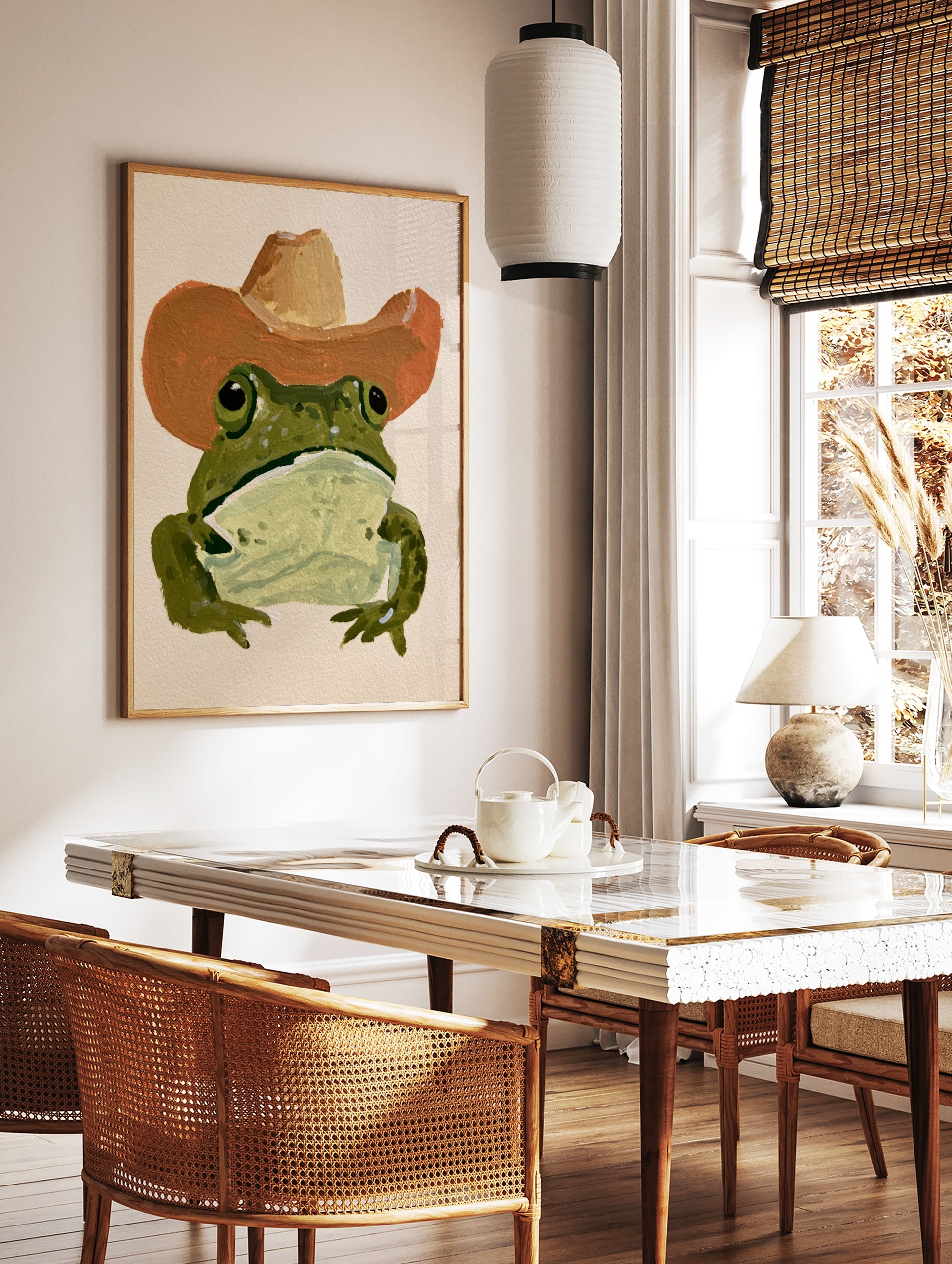 Green frog wearing a brown cowboy hat in a painterly illustrative style art print, in a styled room mockup