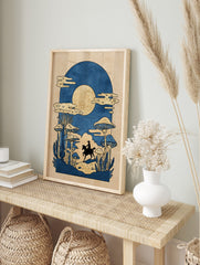 Illustrative print of cowboy on horse in mushroom forest under golden moon, blue and gold, in an alternate framed mockup