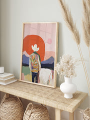 Abstract cowboy art print with figure in colourful jacket, white hat, red sun, and purple, in an alternate framed mockup