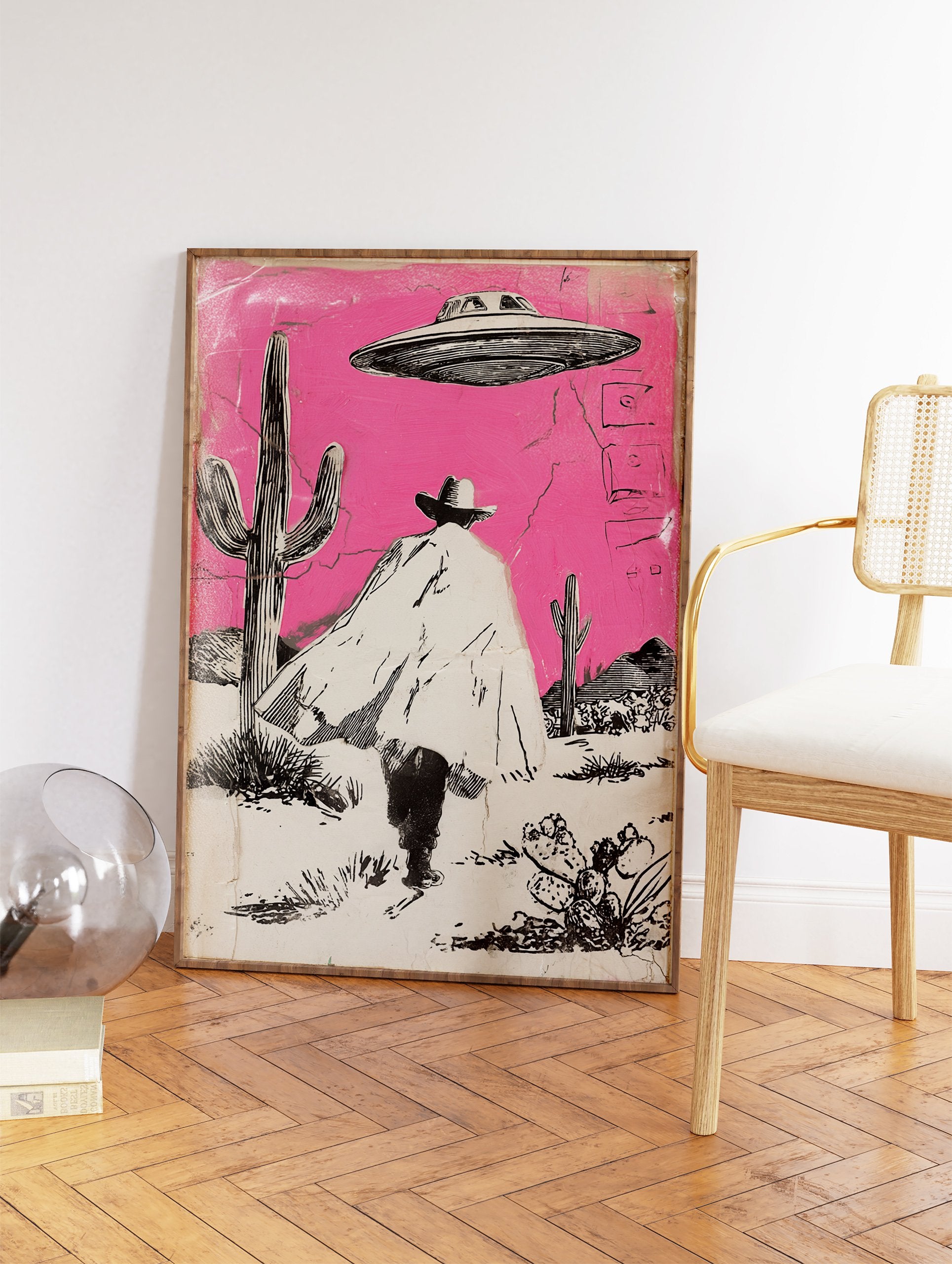Illustrated Cowboy UFO art print featuring a cowboy in a pink desert with cacti and a flying saucer overhead. - Image 2