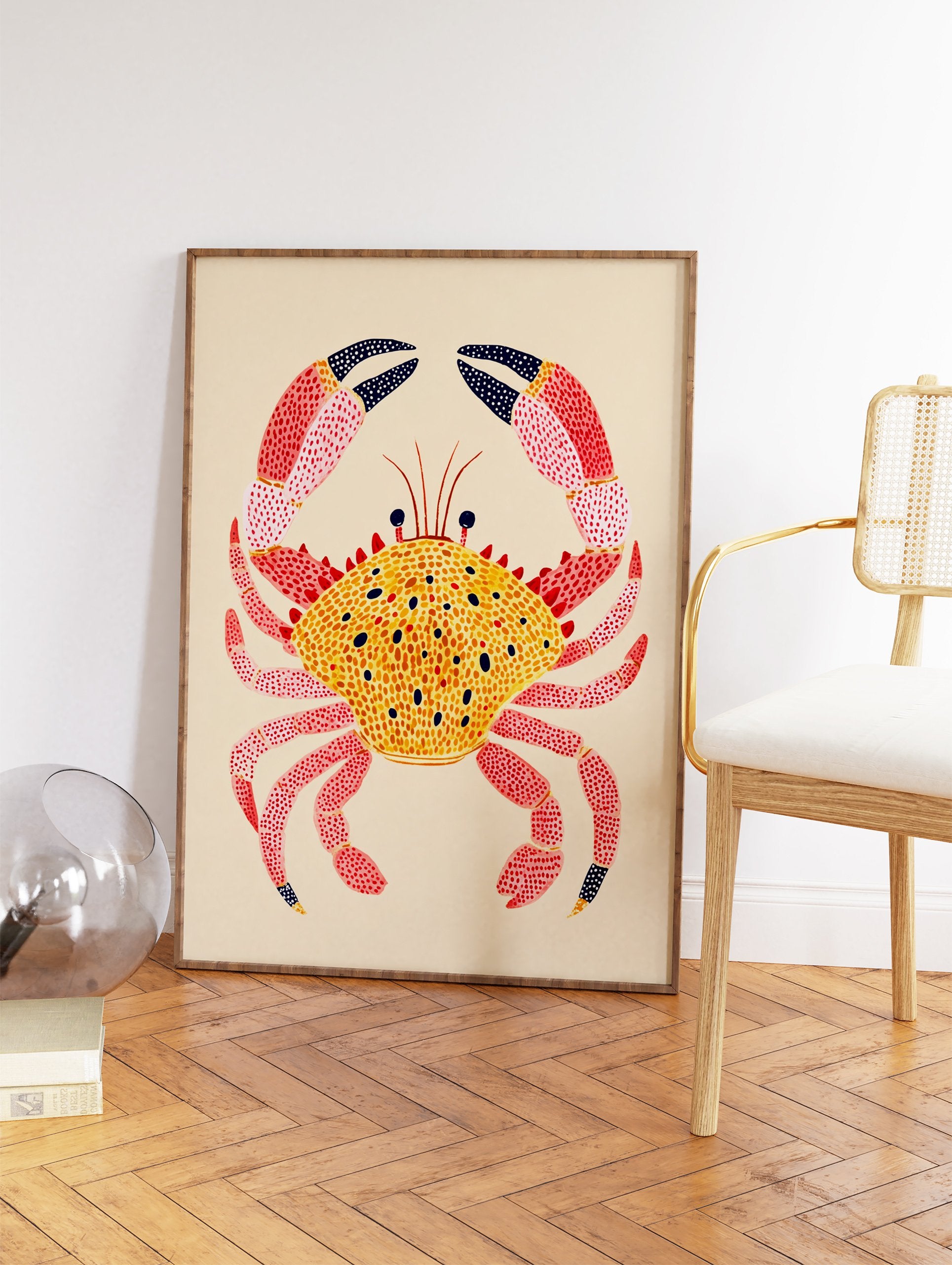 Colorful illustrated crab wall art print with a yellow spotted shell and pink spotted legs on a light beige background. - Image 2