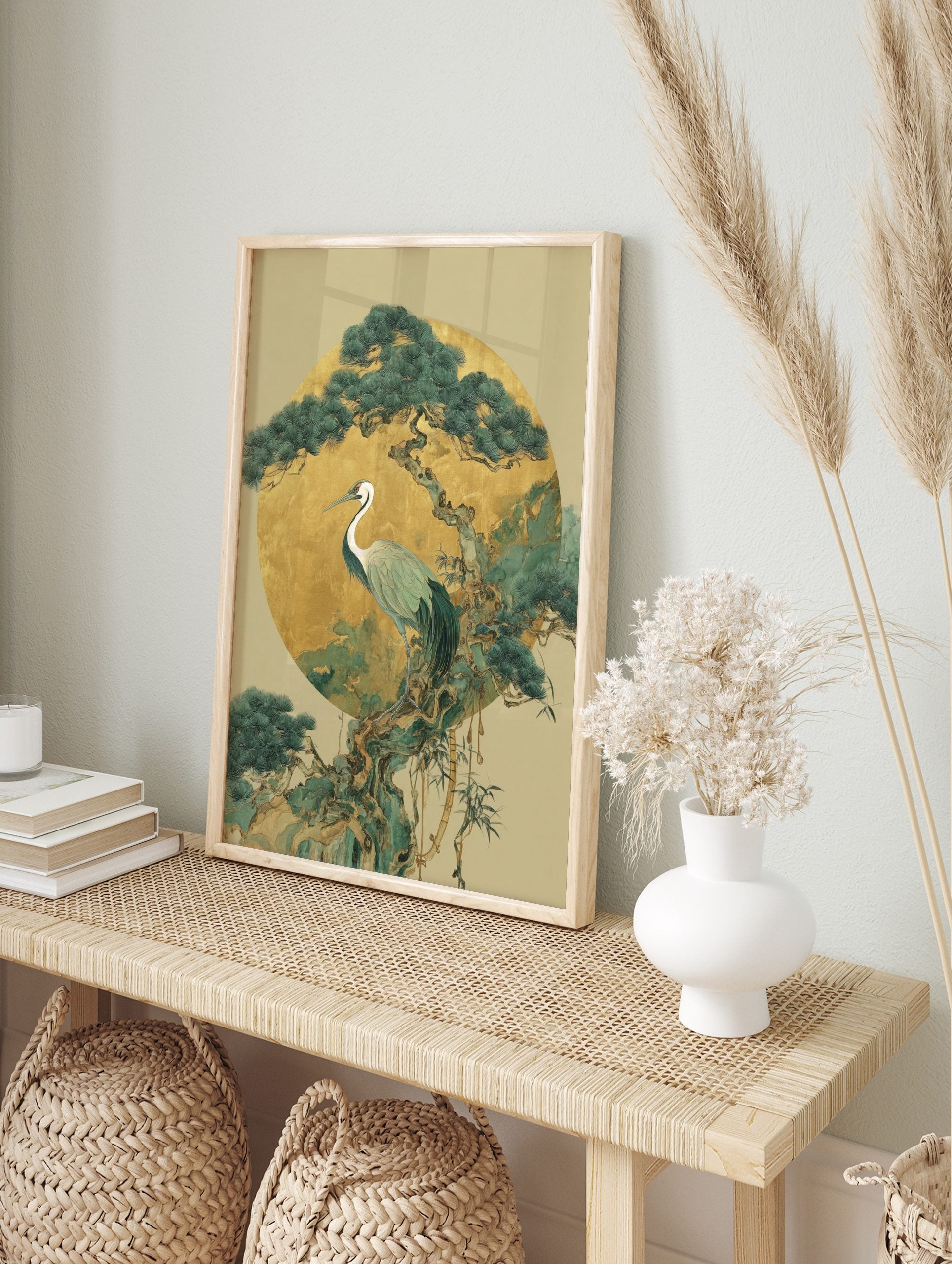 White-necked crane on pine tree branch against gold circle, Japanese illustrative art print, in an alternate framed mockup